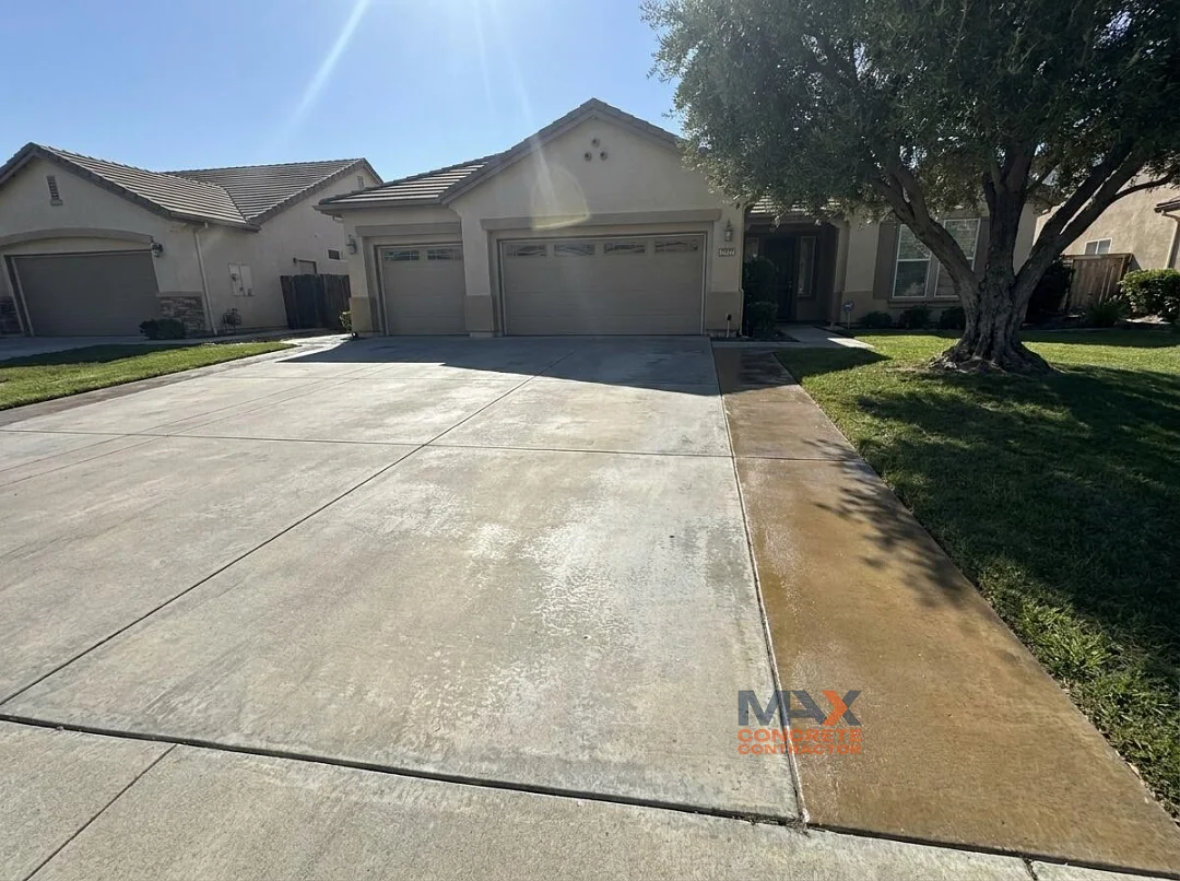 Sun-worn acrylic sealer compared to a shaded, glossier section on a driveway in Irvine, CA