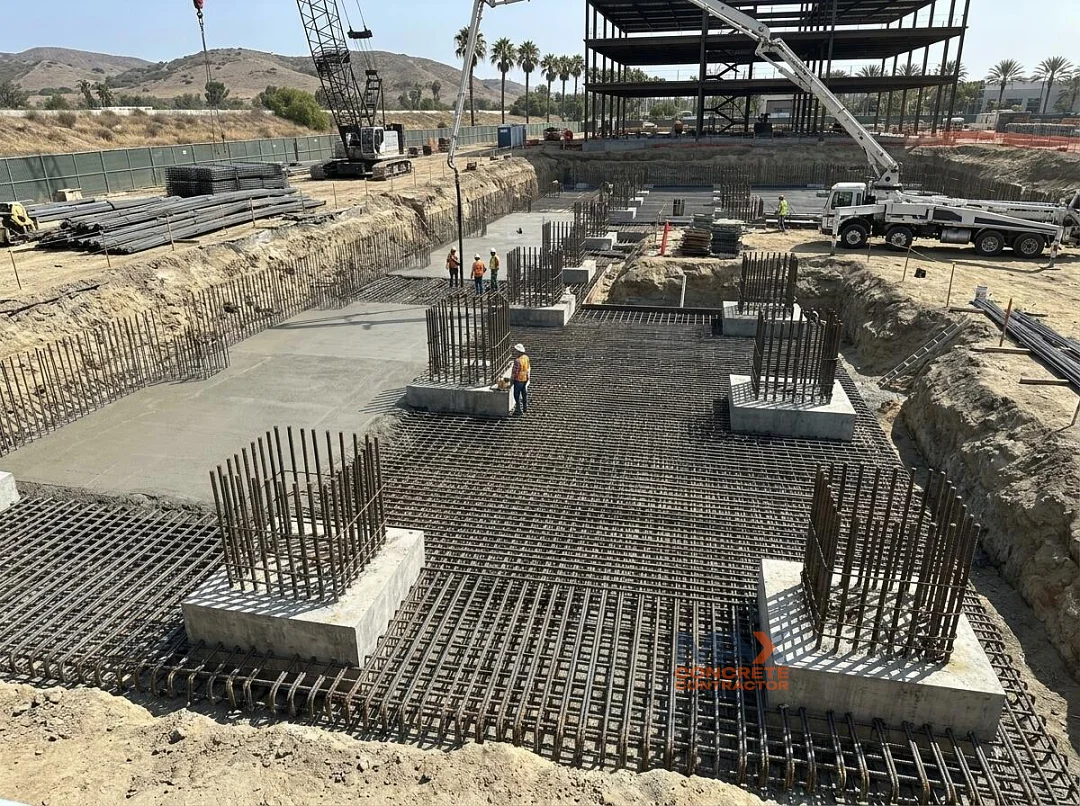 Heavily reinforced commercial building foundation with pile caps under construction in Irvine, CA