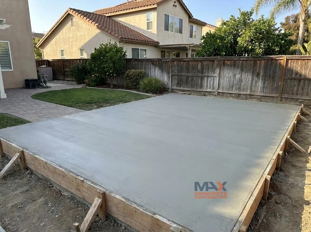 Slab-on-grade foundation with anchor bolts for a backyard ADU under construction in Irvine, CA